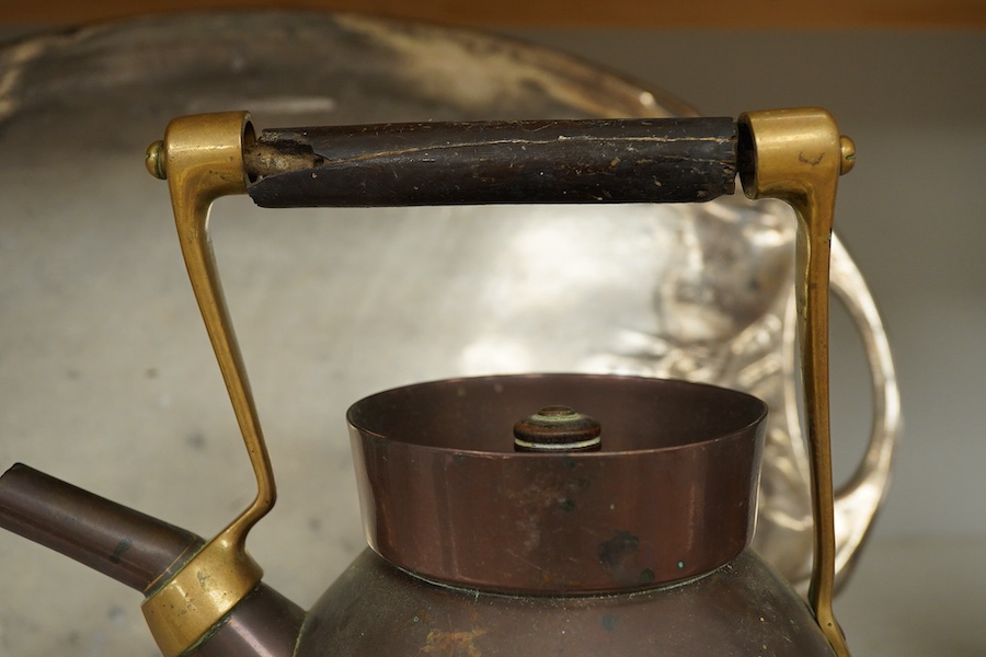 An Arts and crafts copper and brass Benham & Froud stamped Christopher Dresser teapot, (A.F), together with a two handle tray stamped Torini &Sons, Tray 49cm wide.